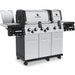 Broil King Regal S 690 Pro IR dual-oven grill, angled front view with side burner and dual ovens