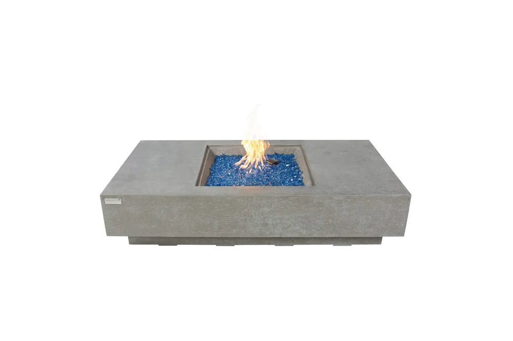 Elementi Plus Monte Carlo OFG416LG light gray fire table with blue fire glass and flame.