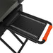 Close-up of Blackstone griddle side shelf with orange handle and steel vented tray for outdoor cooking