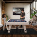 Family playing a game on the Freetime Fun Baddah Bing 54" Bumper Pool Table with rustic oak wood finish