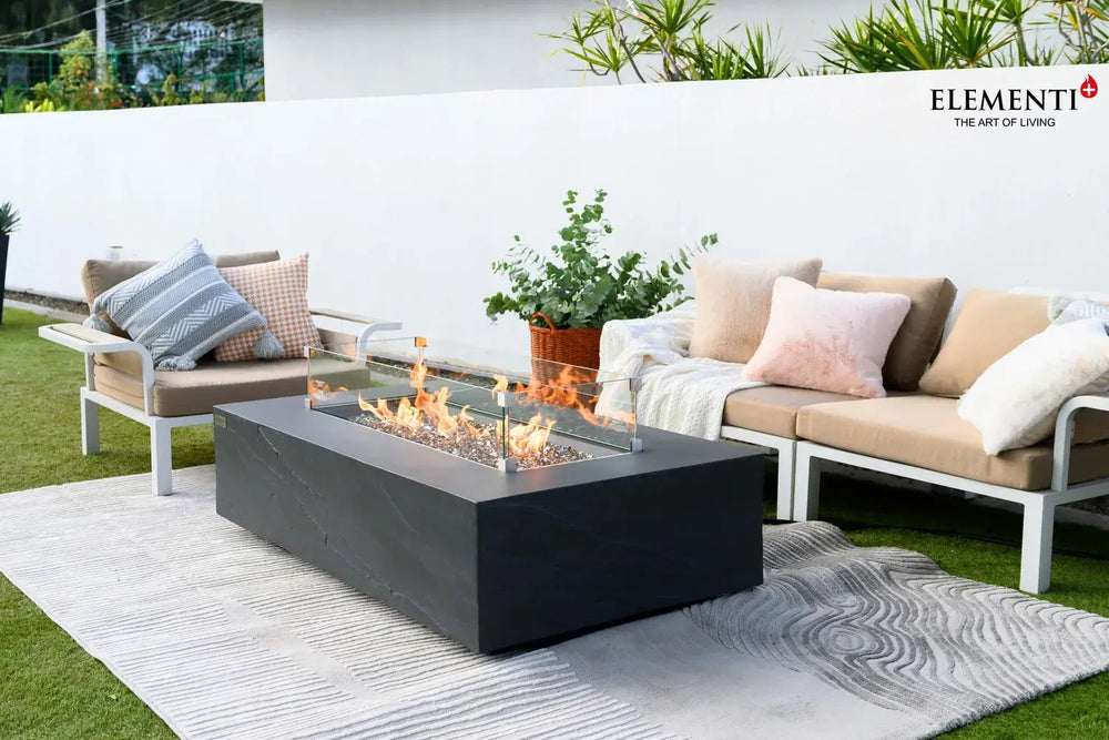 Close-up of Cape Town fire table glass wind guard and slate black GFRC texture.