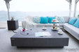 The Elementi Metropolis fire table shown with a circular stainless steel lid covering the burner to maximize usable table space.