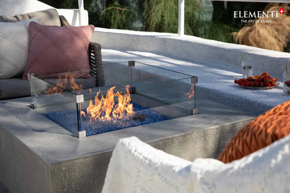 Close-up of Victoria fire table glass wind guard and space gray GFRC texture.