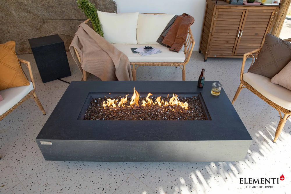 Elementi Plus Positano dark gray rectangular fire table with fire glass and flame.