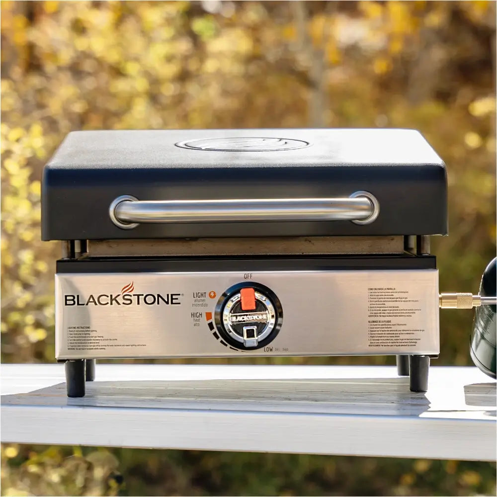 Blackstone 17-inch tabletop propane griddle with hood, single burner control and compact outdoor design