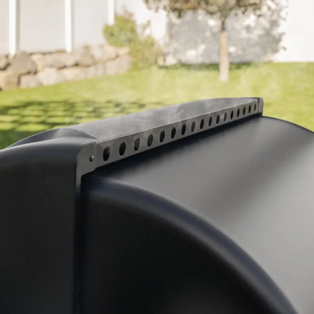 Close-up of Blackstone Pellet Grill hood vent showing built-in steam release and ventilation holes