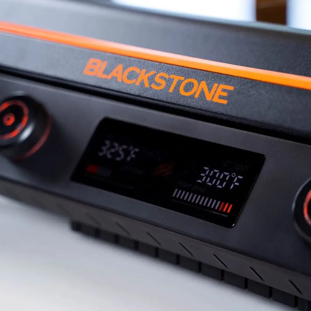 Close-up of Blackstone E-Series griddle's digital display showing independent temperature zones in Fahrenheit