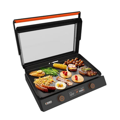 Open Blackstone 22-Inch tabletop griddle cooking a full breakfast including eggs, pancakes, vegetables, steak, and sausage