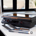 Blackstone E-Series electric griddle on kitchen counter with spatulas and tongs, dual temperature zones displayed on LED screen