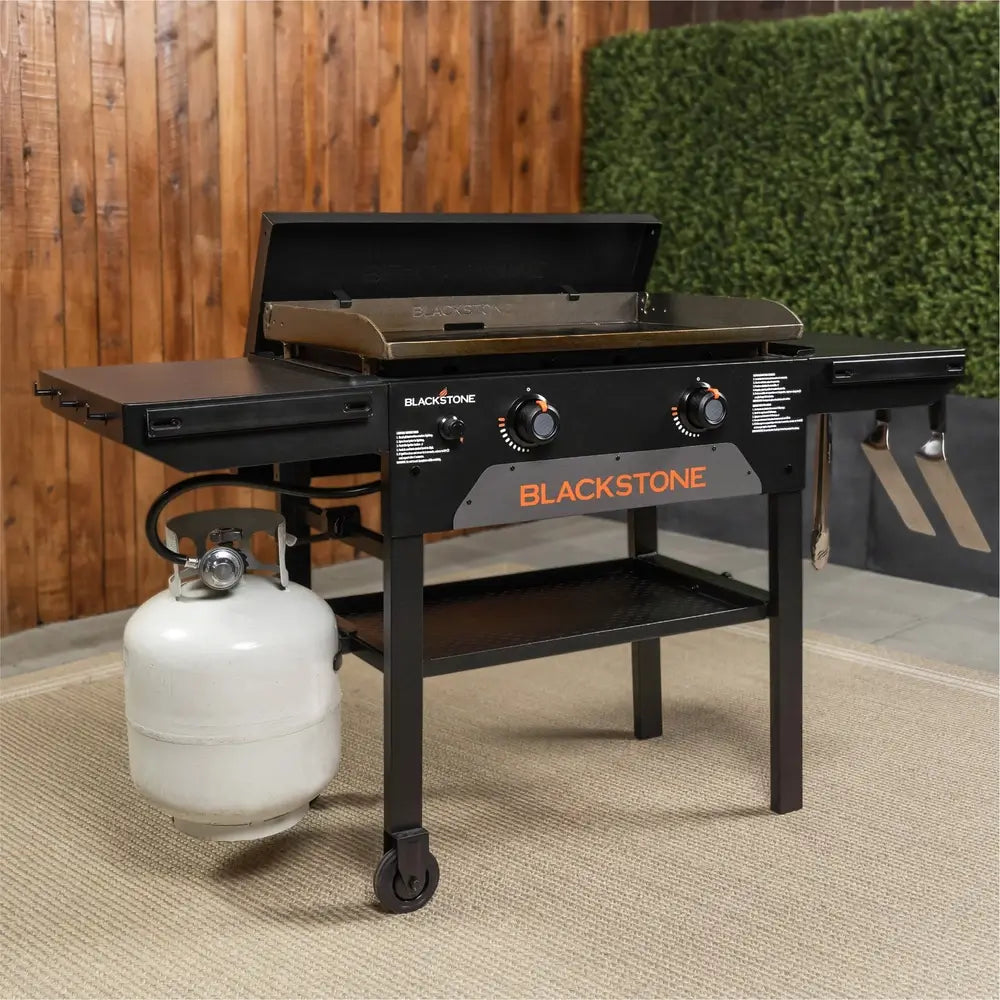 Blackstone 28-Inch Gas Griddle in Backyard Setup with Propane Tank – Ideal for Outdoor Cooking and BBQ