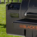 Close-up of Blackstone 2258 smoker and air fryer combo with visible storage and side shelves