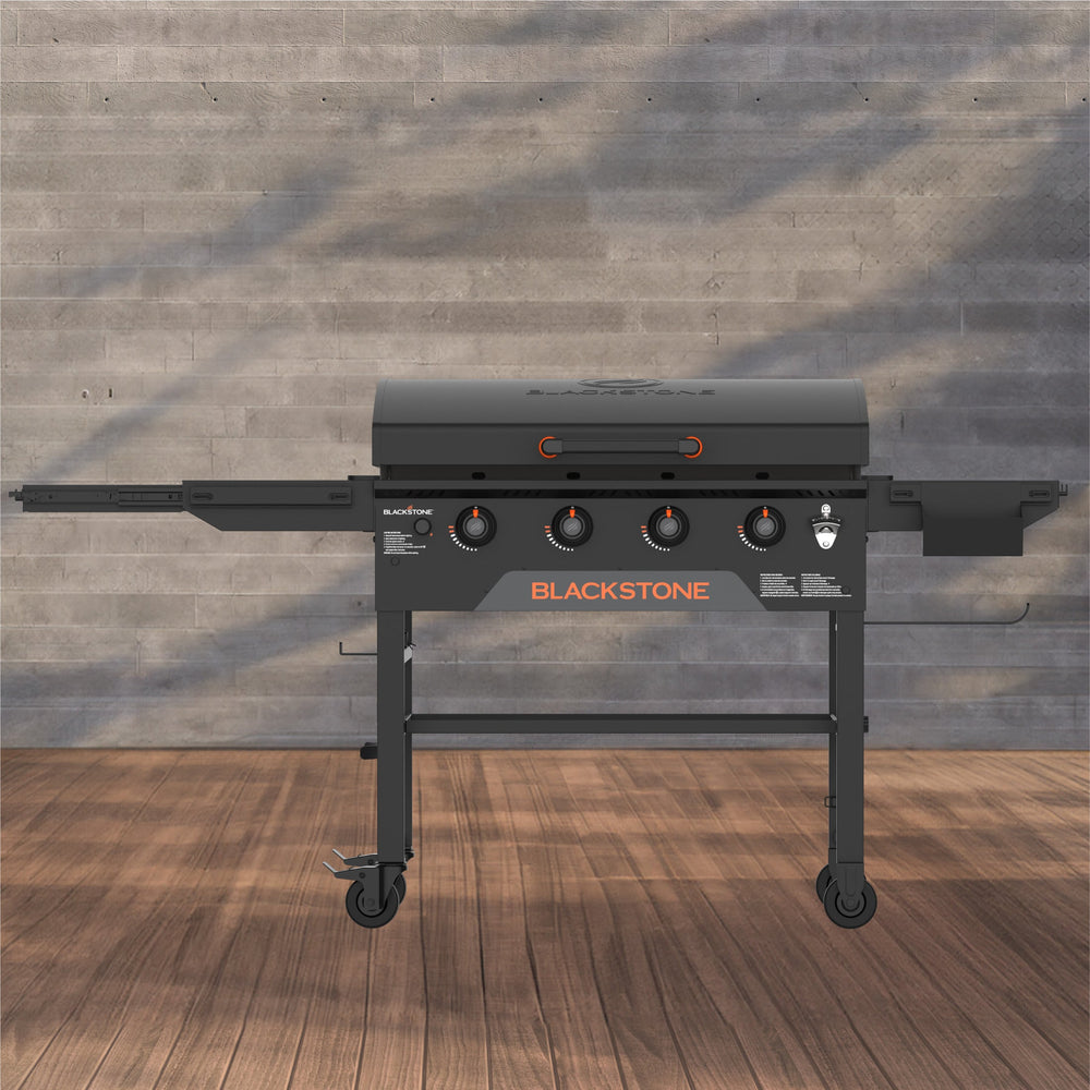 Blackstone 36-inch stainless steel omnivore griddle with cabinet and 5 burners – premium outdoor propane flat top grill for backyard cooking.
