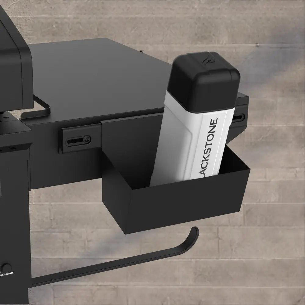 Blackstone griddle rear grease management system with removable bottle for easy cleanup and storage.