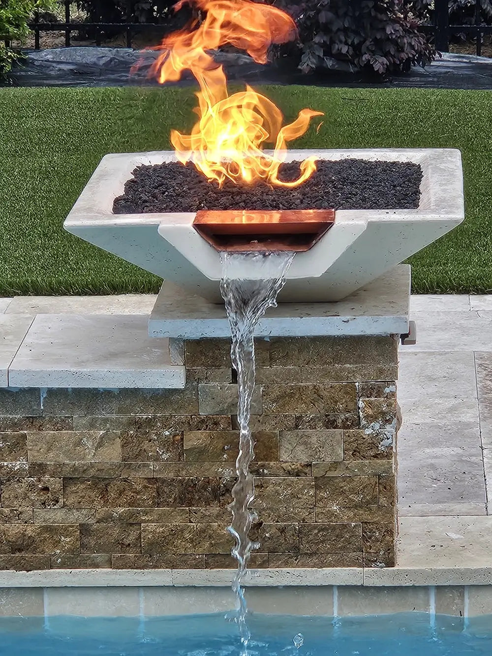 Travertine TessaRai Square Fire/Water Bowl Kit with copper spillway, lava rock flame and stacked stone pool pedestal
