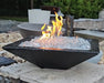 Travertine TessaRai 36 inch Square Fire Bowl Kit with clear fire glass and bright flames in outdoor showroom setting