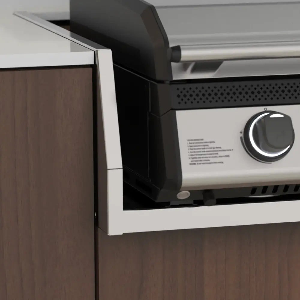 Corner installation view of Blackstone Drop-In Griddle showing flush mount within custom outdoor kitchen cabinetry