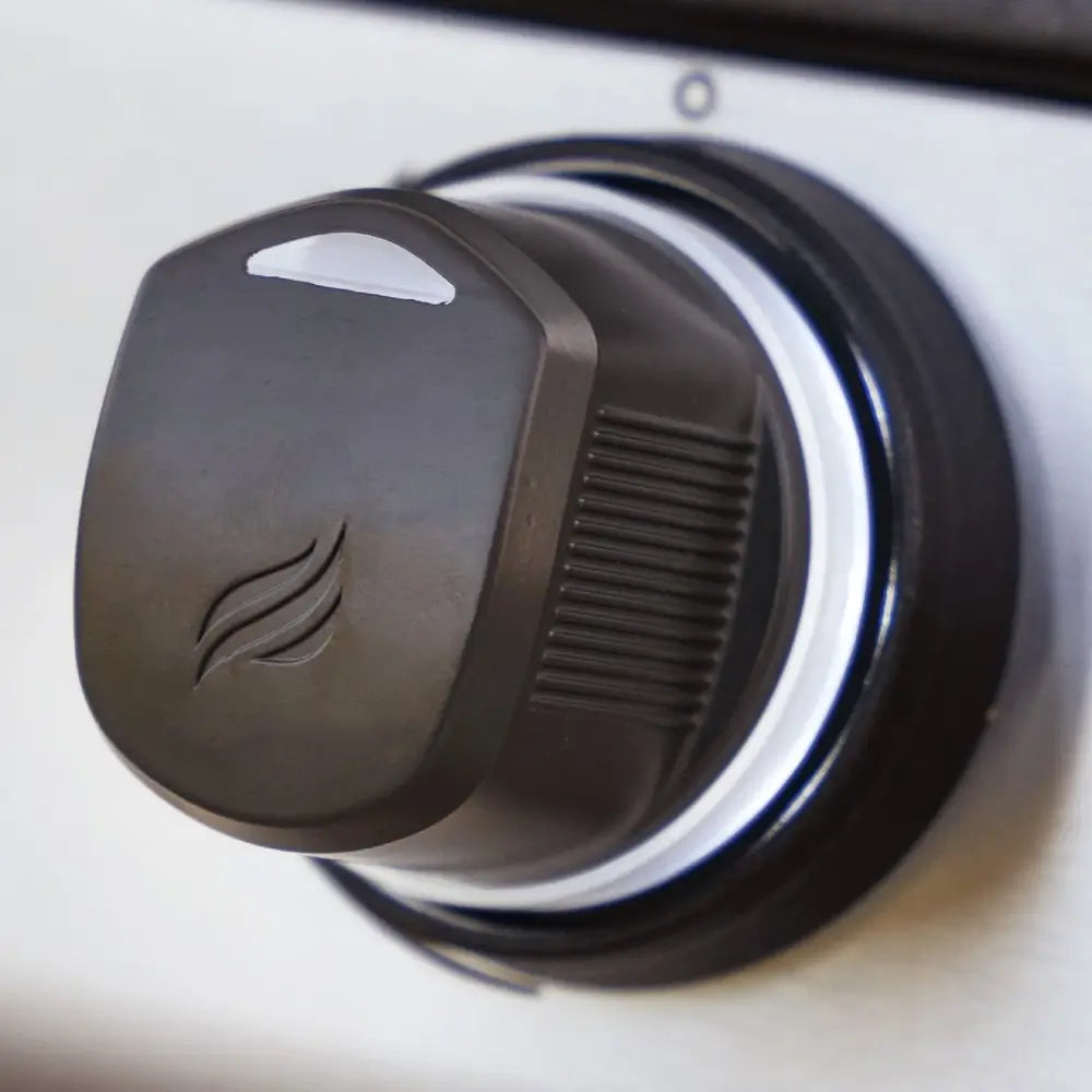 Close-up of Blackstone Drop-In Griddle LED control knob with flame icon for temperature adjustment