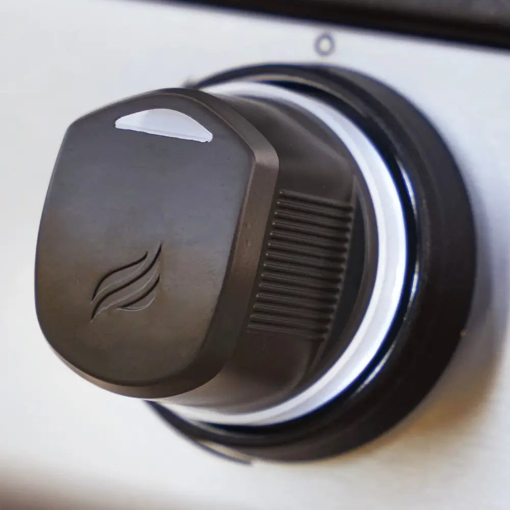 Detailed close-up of flame-etched control knob on Blackstone outdoor drop-in gas griddle
