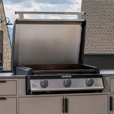 Blackstone 28-Inch Drop-In Griddle open in built-in outdoor kitchen setup, perfect for backyard grilling and entertaining