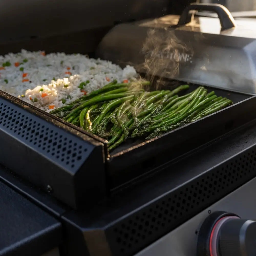Vegetables and rice sizzling on Blackstone 28-Inch Drop-In Griddle with precision cooking and even heat distribution