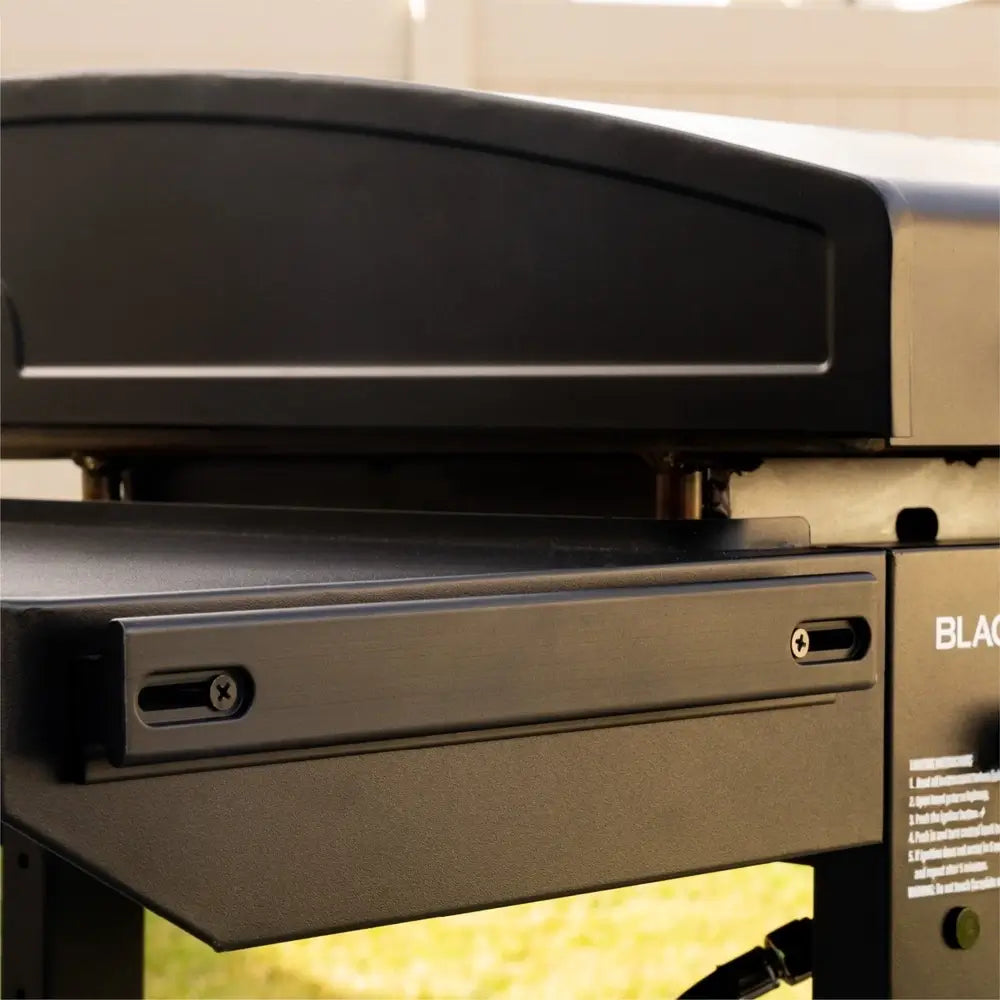 Angled top view of Blackstone 28-inch Omni griddle showing full cooktop and folded side shelf