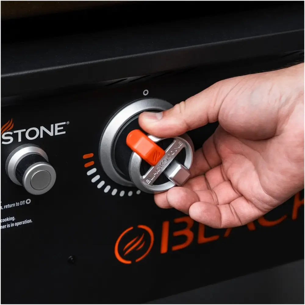 Close-up of electric ignition dial on Blackstone 28-Inch griddle for precise temperature control