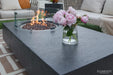 Elementi Metropolis rectangular fire pit with a stainless steel burner cover to protect the lava rocks and extend table space.