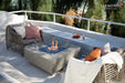 Modern outdoor lounge featuring the Victoria rectangular fire pit table and designer patio furniture.