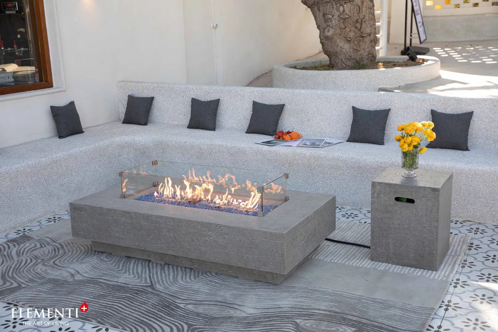 Elementi Plus Riviera light gray rectangular fire table in contemporary outdoor lounge setting.