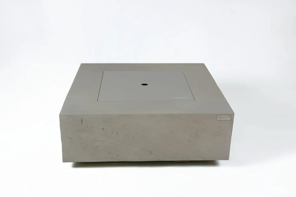 Elementi Plus Capertee fire table used as a patio coffee table with burner lid.