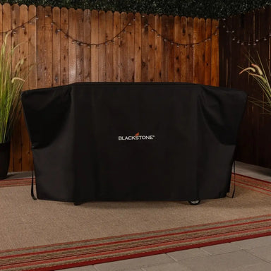 Blackstone grill cover protecting a 36-inch griddle outdoors, blending into patio décor with secure, stylish design