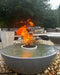 Close-up of an active TessaRai 360 fire and water bowl kit highlighting the dancing flames and lava rock center.