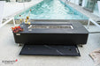 A detail shot showing the fire pit's functionality, with the burner lid being stored in a dedicated sliding drawer located directly underneath the table frame.
