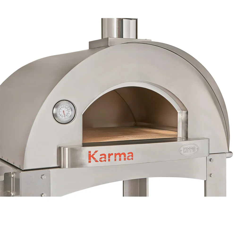 WPPO Karma 32 professional wood-fired oven close-up with stainless steel dome, arched opening, thermometer, and Karma logo.