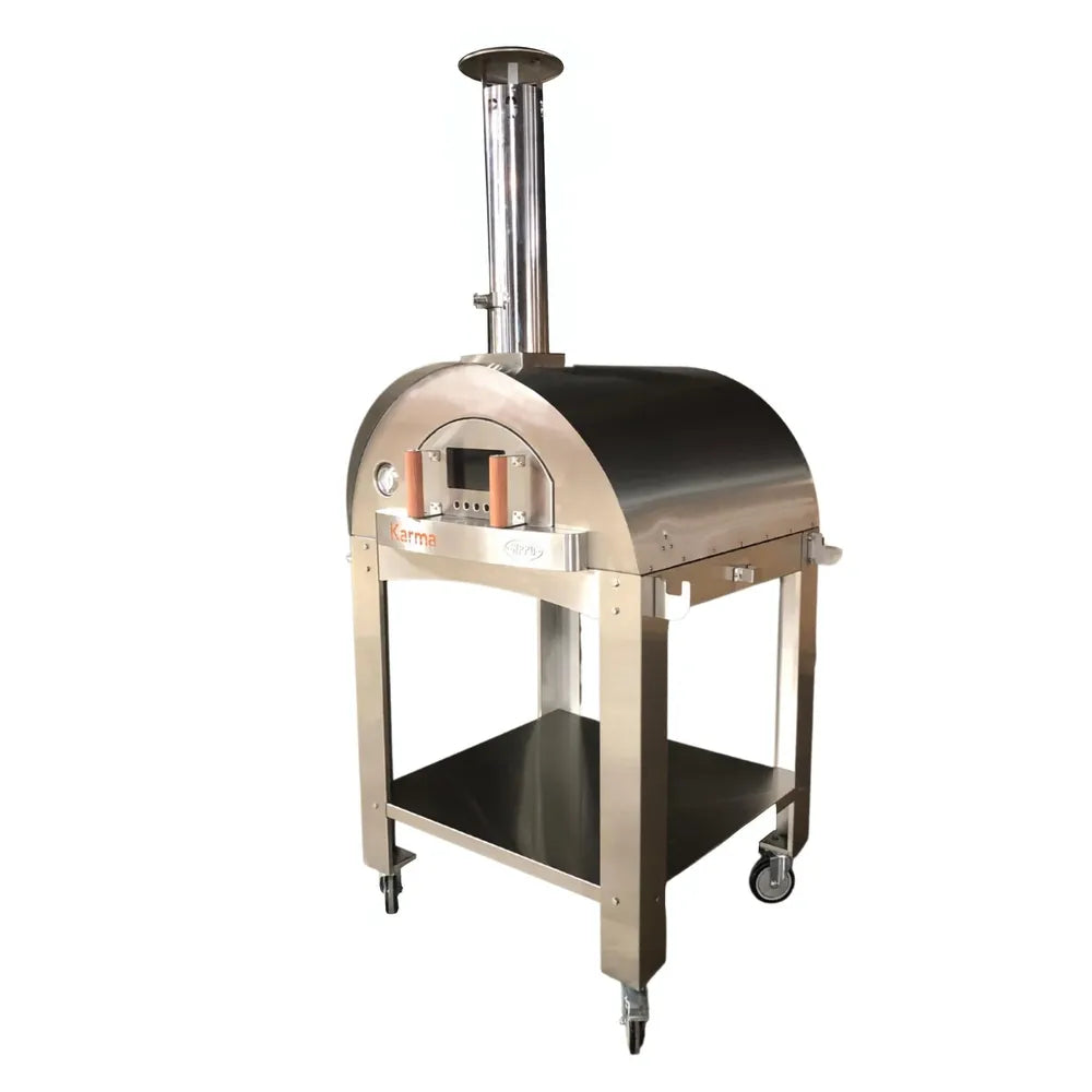 Angled view of WPPO Karma 42 stainless steel wood-fired pizza oven with chimney, black dome, cart, and wheels.