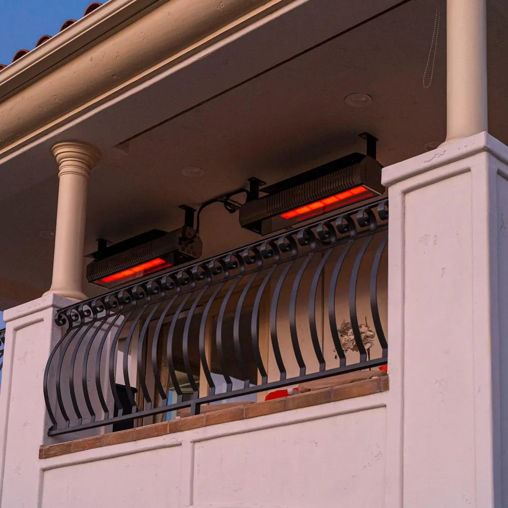 High-end waterfront restaurant patio utilizing wind-resistant SunStar MGL0 infrared heaters for consistent guest warmth.