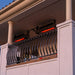 High-end waterfront restaurant patio utilizing wind-resistant SunStar MGL0 infrared heaters for consistent guest warmth.