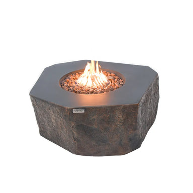 Elementi Columbia fire table with a natural rock texture and flickering orange flames.