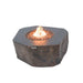 Elementi Columbia fire table with a natural rock texture and flickering orange flames.