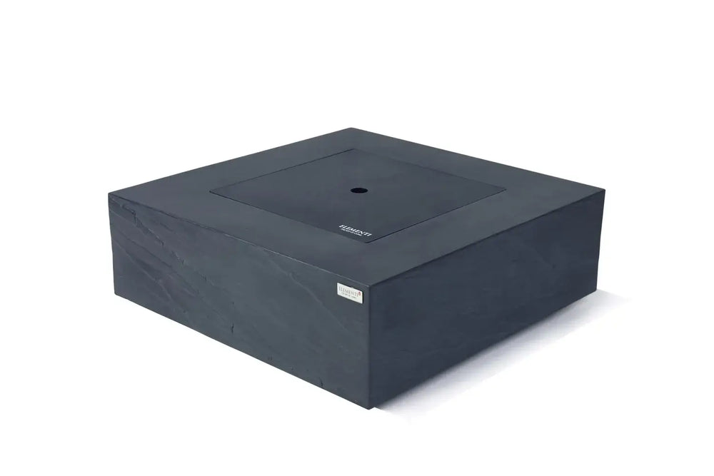 Elementi Plus Roraima fire table used as a patio coffee table with burner lid.