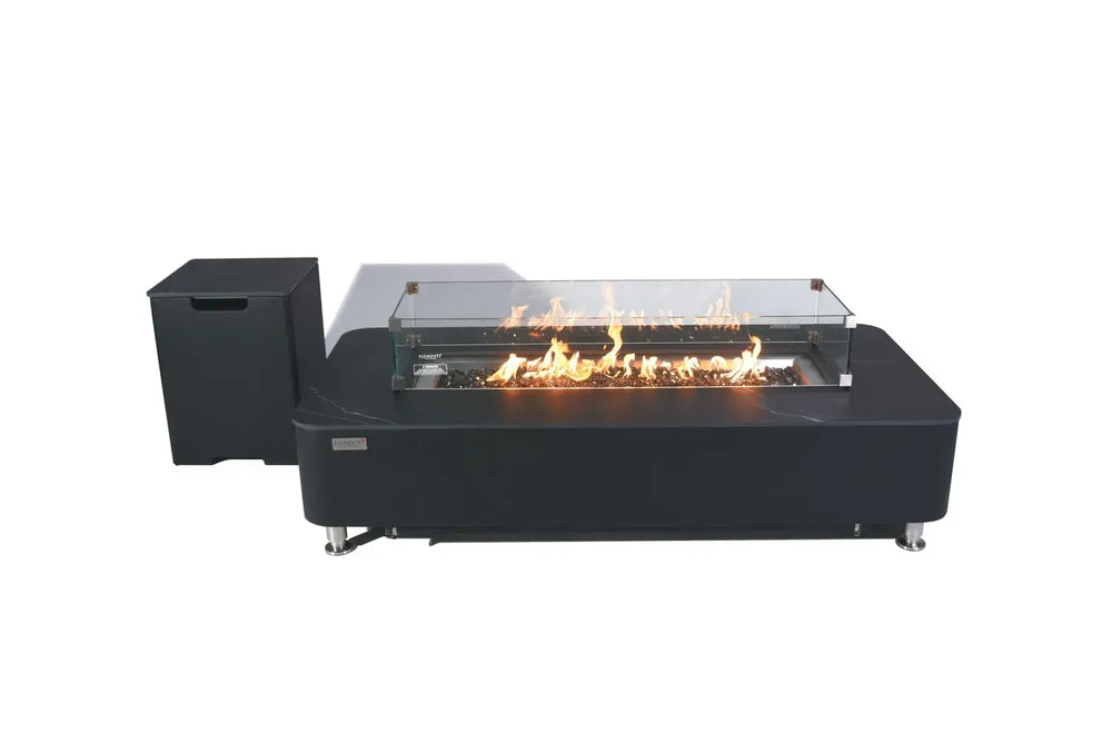 A product shot on a white background showing the fire pit table with its glass wind guard and a matching black rectangular tank cover sitting alongside it.