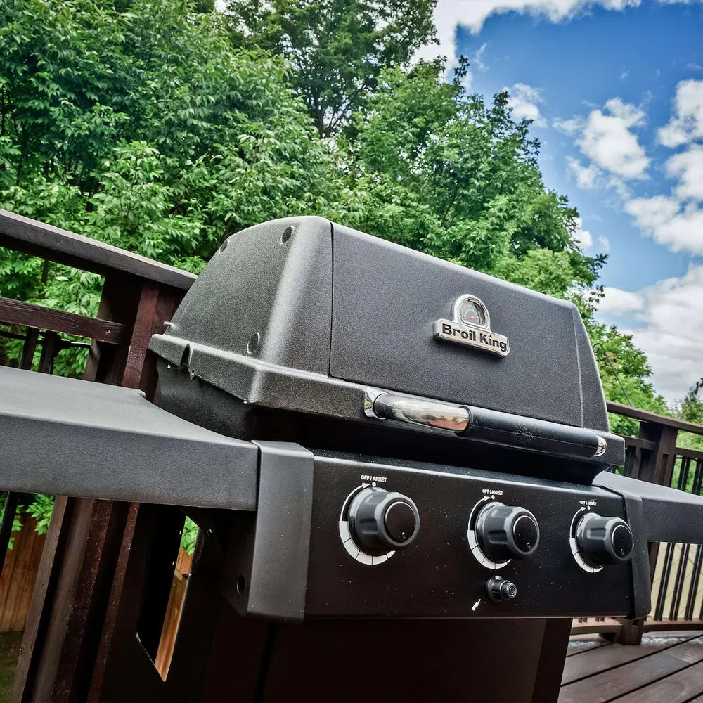 Broil King Crown 310 Shadow gas grill in black on patio