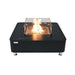 Black porcelain Elementi fire table featuring a square glass wind guard and central burning flame.