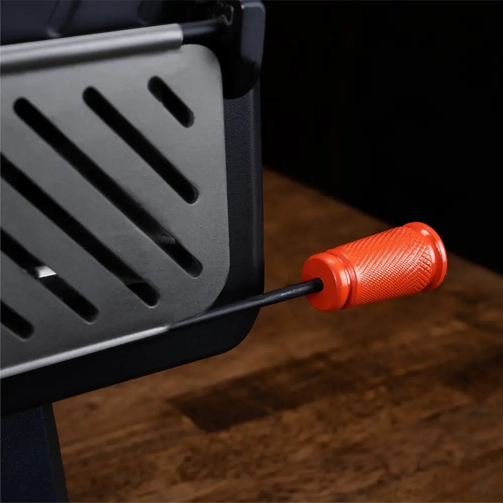 Close-up of Leggero Pro pizza oven showing textured orange door handle and heavy-duty construction