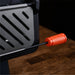 Close-up of Leggero Pro pizza oven showing textured orange door handle and heavy-duty construction