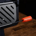 Close-up of Leggero Pro pizza oven showing textured orange door handle and heavy-duty construction