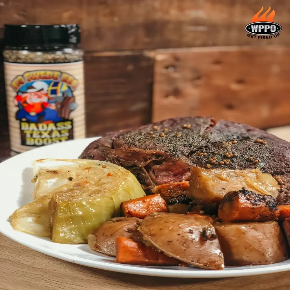 WPPO Karma 42 wood-fired oven cooking roast meat, cabbage, carrots, and potatoes with Badass Texas Boost seasoning.