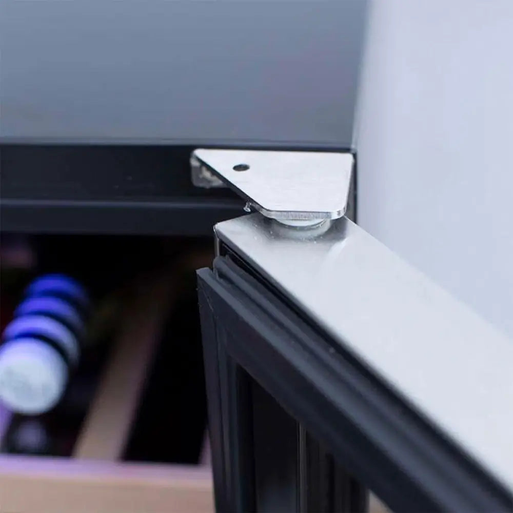 Close-up of Summerset stainless steel door hinge detail on top corner of the wine cooler.
