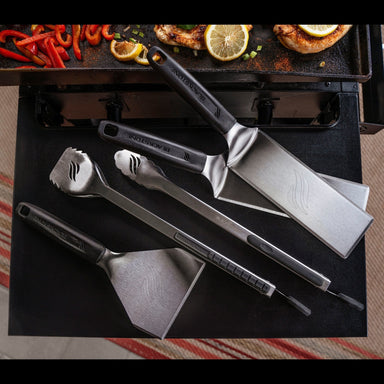 Blackstone Griddle Cooking Tool Set Displayed on Griddle Table – Stainless Steel Spatulas, Tongs, and Scraper for Backyard BBQs
