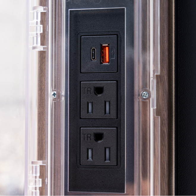 Close-up of Blackstone Pavilion built-in power strip with AC outlets and USB ports for griddle accessories